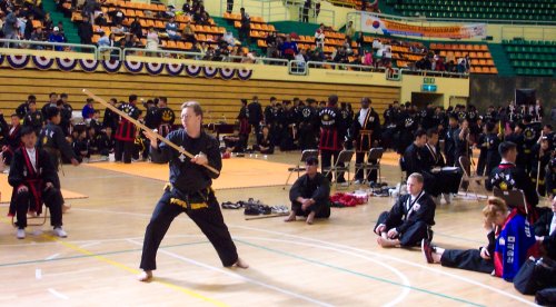 Ken Schalk performing a staff form at the 2002 world Kuk Sool championship in Gyeongju, Korea